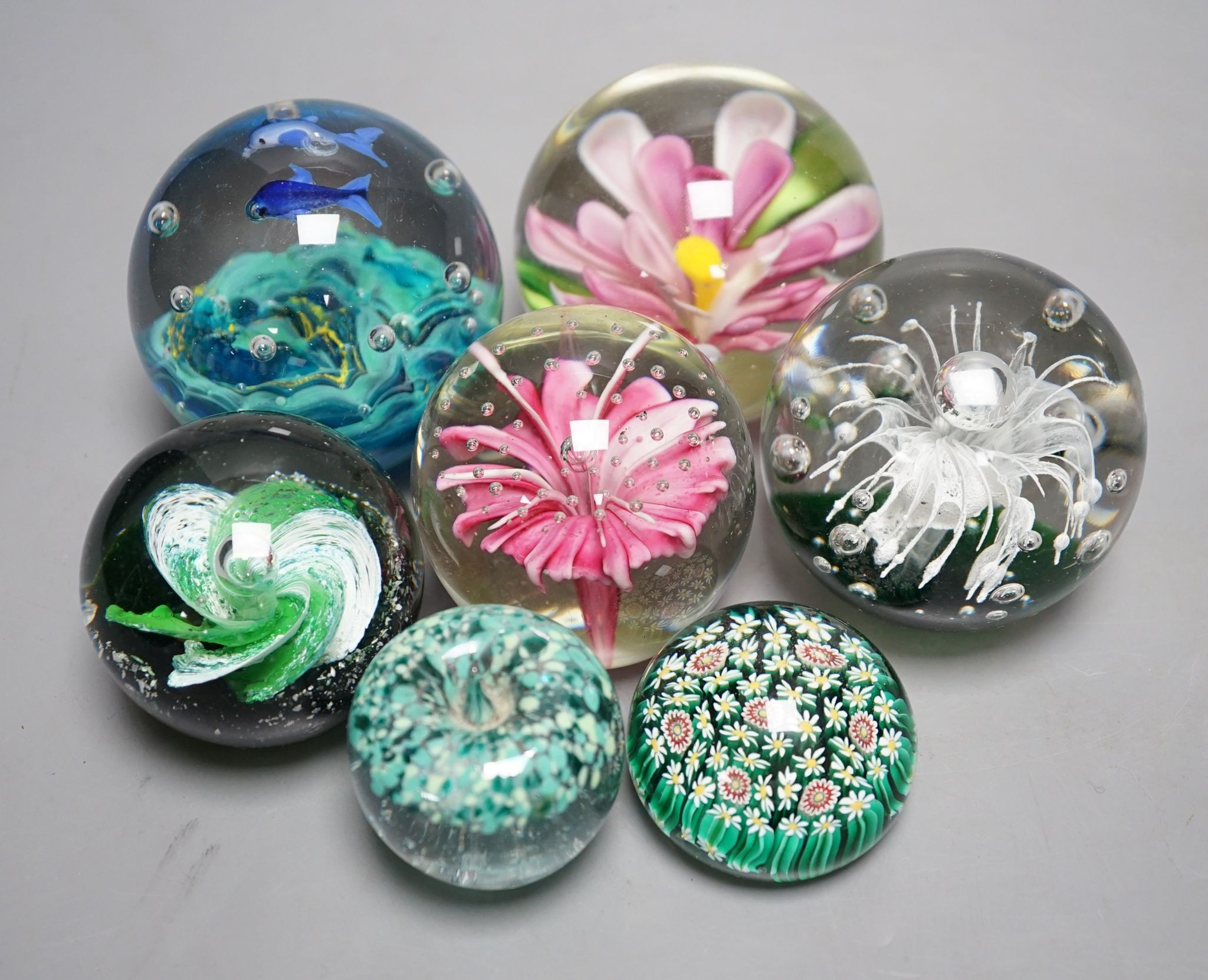 A group of glass paperweights including Caithness